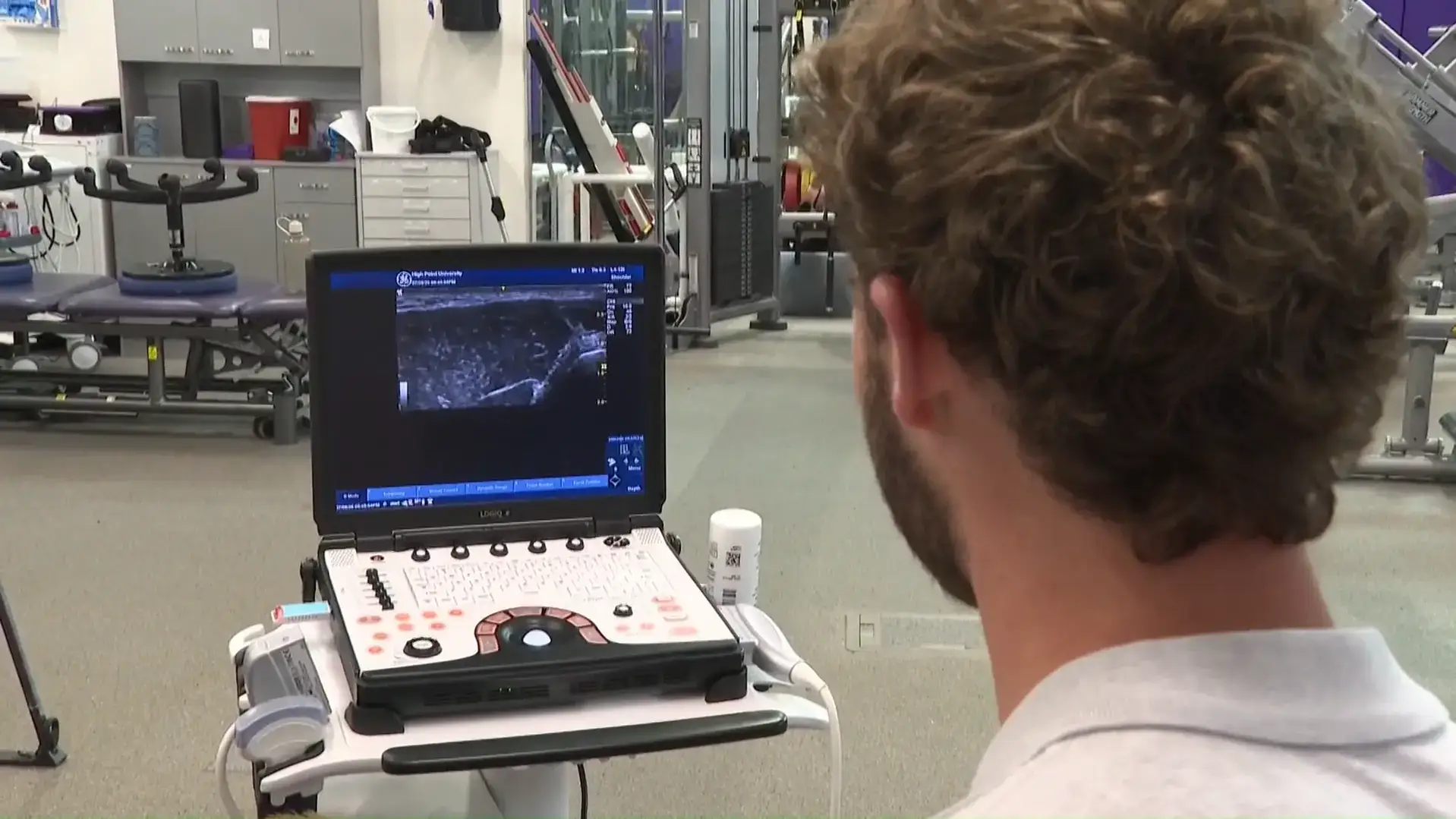 A High Point University student using the GE Logiq e NextGen R7 portable ultrasound machine to study anatomy.